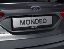Suporte de Placa de Matrícula Ford em cor preto, com logótipo Ford em cor branco e inscrição "BRING ON TOMORROW".