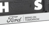 Ford nummerskiltplate sølvfarget, med blå Ford-oval og svarte “BRING ON TOMORROW” bokstaver
